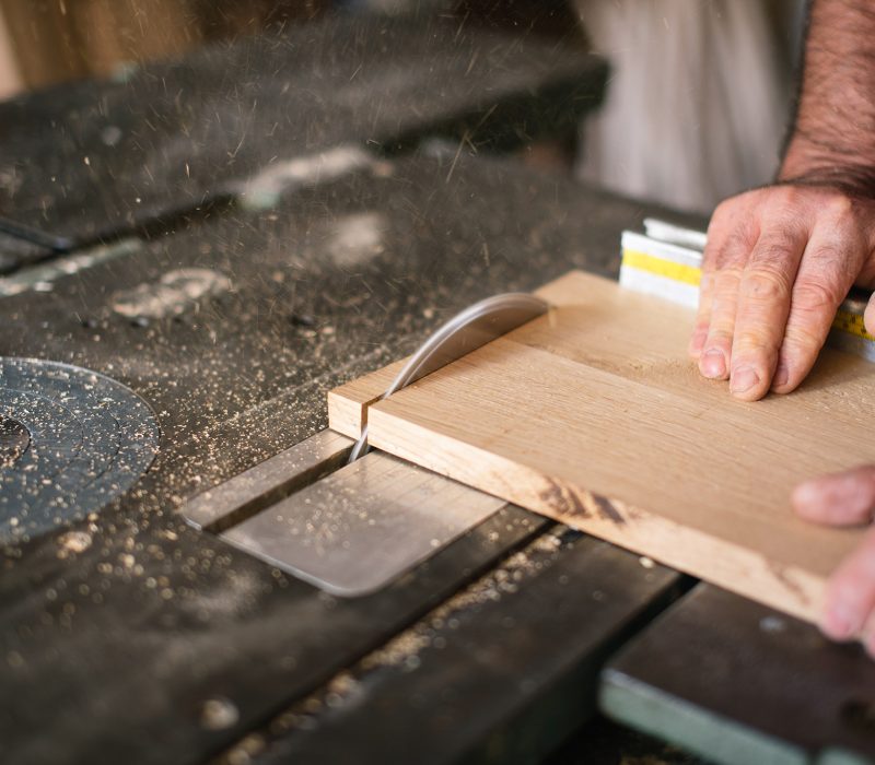 Carpenter working on the circular saw